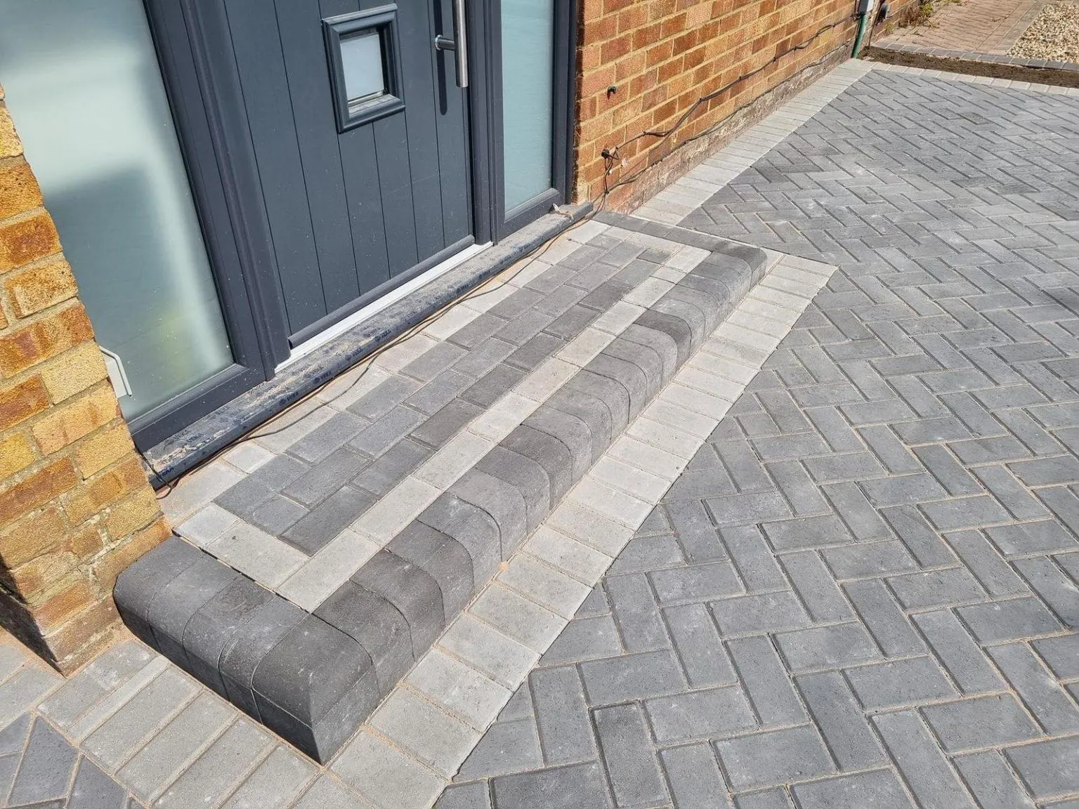 Block paving driveway with contrasting border by Stoneage Property Care