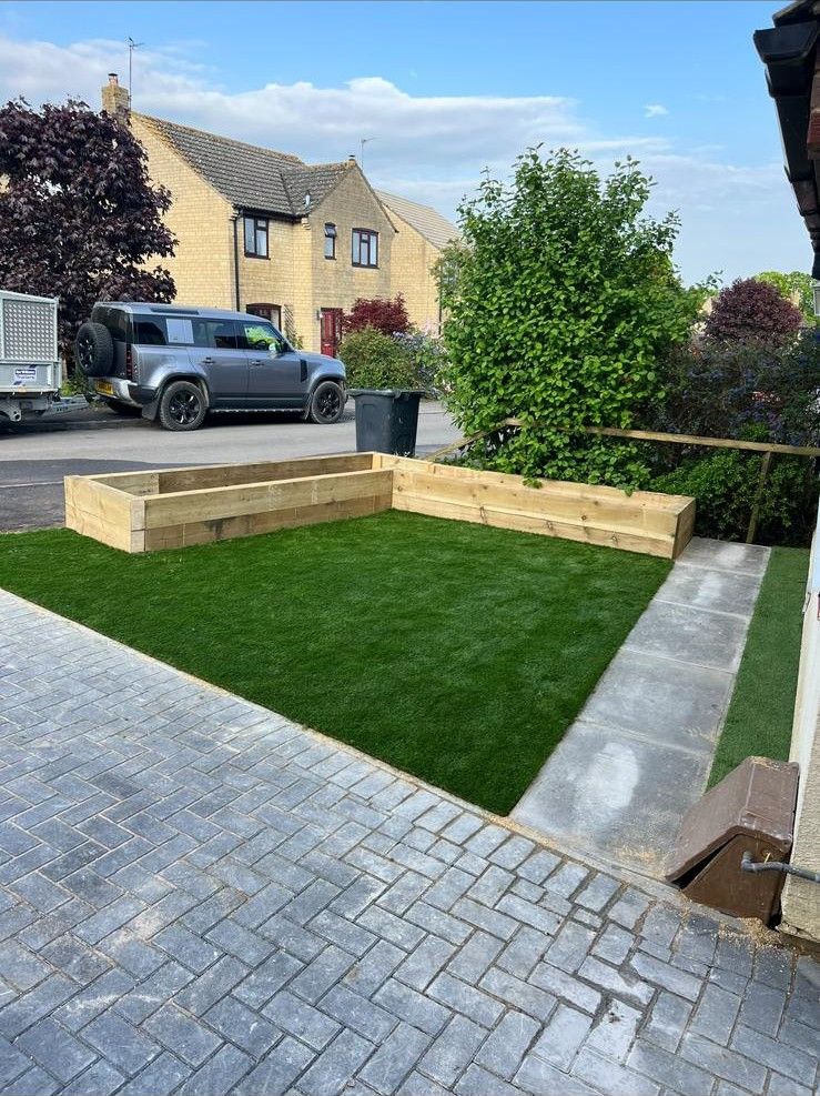 New block paving driveway and lawn by Stoneage Property Care at a home in Wiltshire