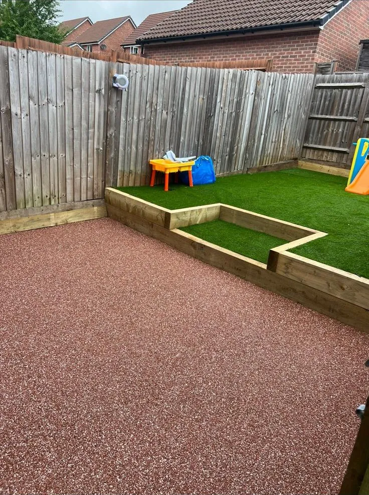 Garden patio area with raised sleeper beds by Stoneage Property Care