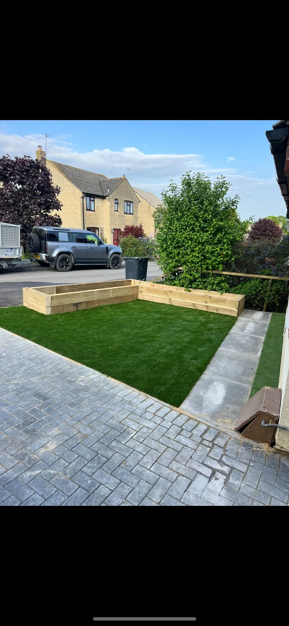 Completed sleeper retaining wall terracing by Stoneage Property Care