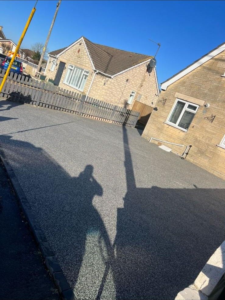 Freshly laid tarmac driveway by Stoneage Property Care in Wiltshire