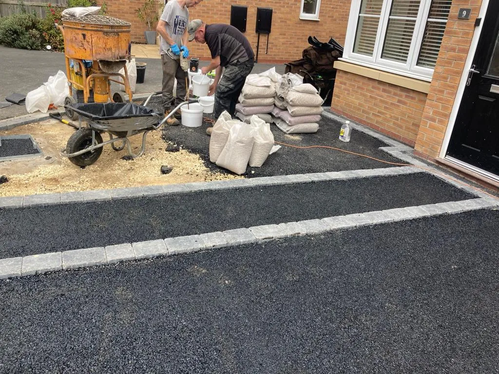 Newly laid tarmac driveway with block edging by Stoneage Property Care